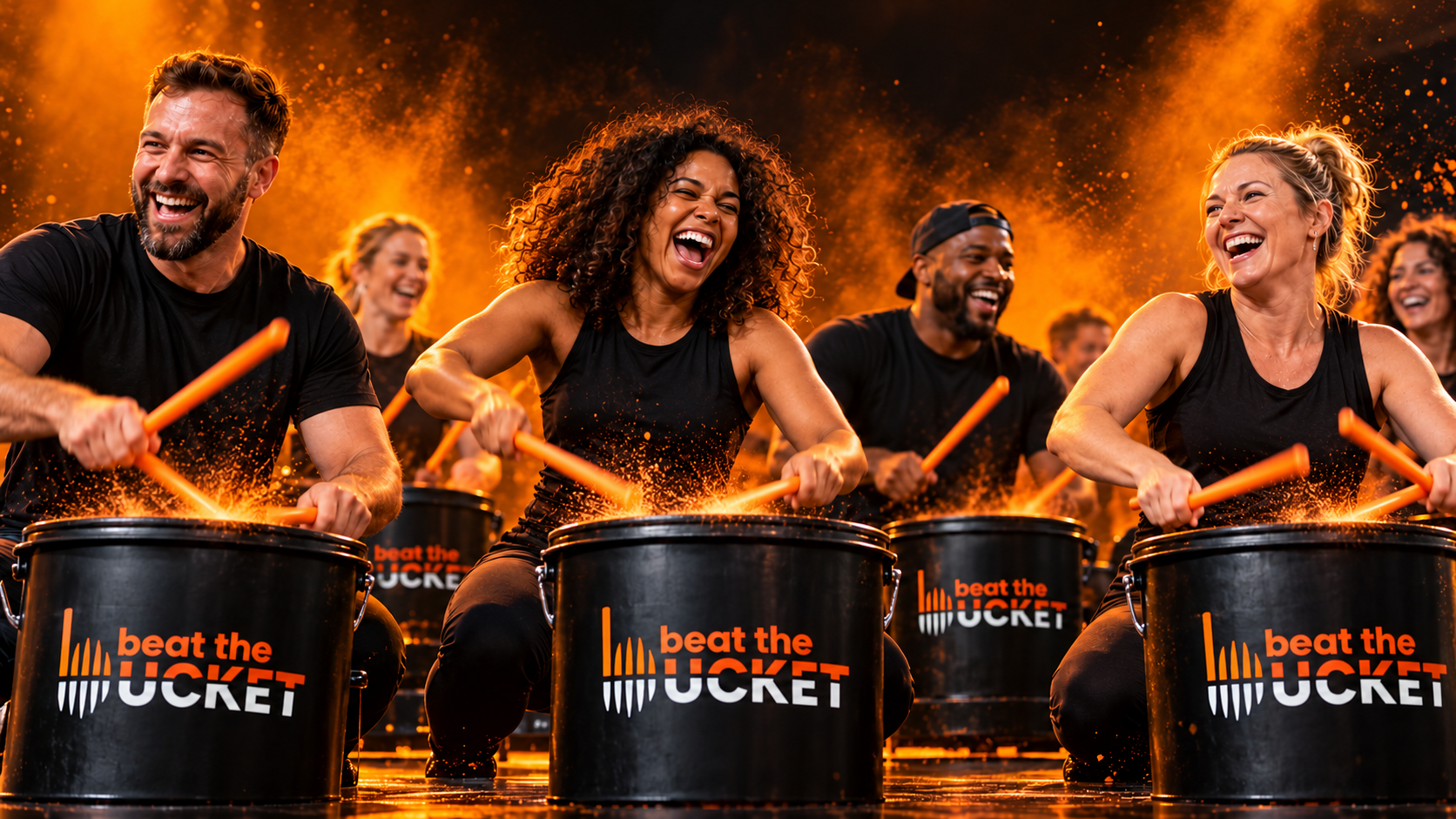 A joyful group using drumsticks to play black Beat The Bucket branded pails.